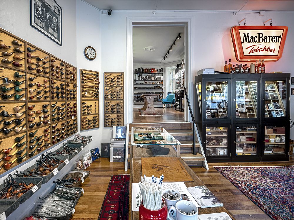 Interior of the shop with the long oak table and pipe and tobacco displays
